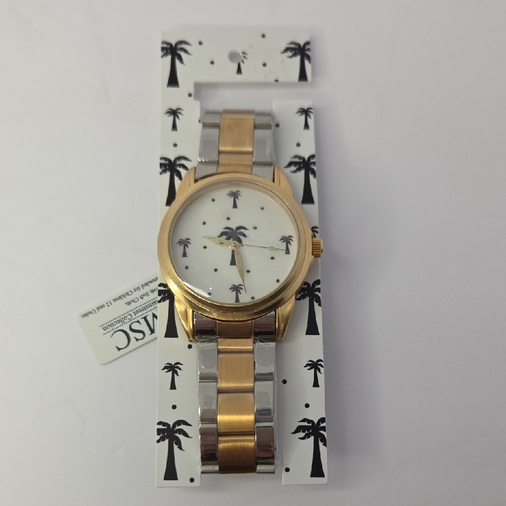 This Mainstreet Collection women's watch features a two-tone and Palm Trees
